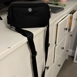 A brand new lululemon cross body bag
